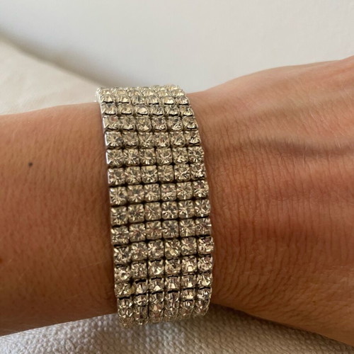 Bracelet with Crystals like new, silver color, elastic and sparkling