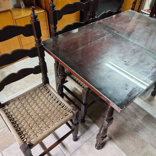 Wooden dining table with 4 chairs and glass top