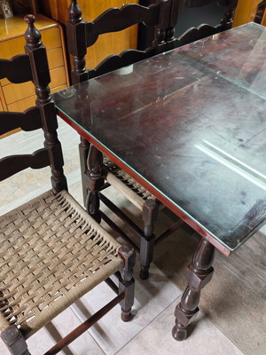 Wooden dining table with 4 chairs and glass top