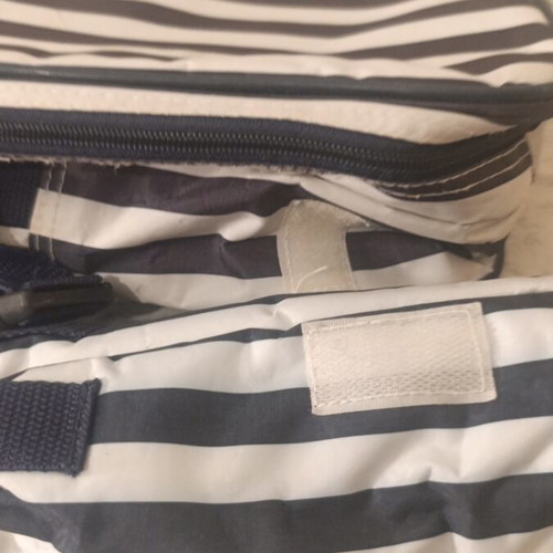 Insulated backpack with bottle holder like new, black and white striped