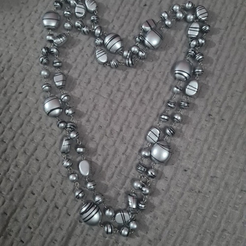 Women's necklace new, long with silver elements and dark stripes