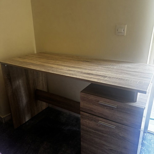 Wooden desk with drawer and open storage, brown oak finish