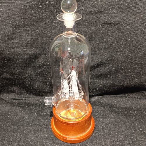 Vintage glass decanter with ship inside, used