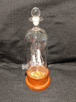 Vintage glass decanter with ship inside, used