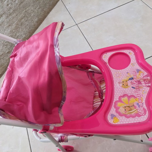 Doll stroller used with wear and fabric tears