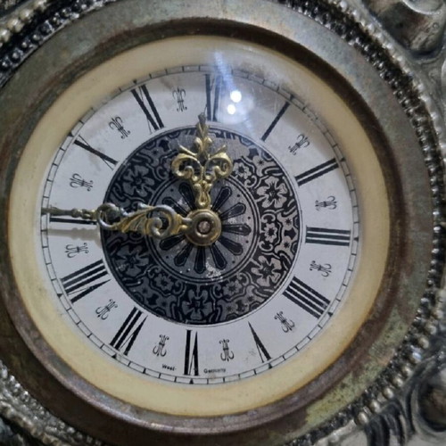 Antique clock used with German mechanism and porcelain decoration