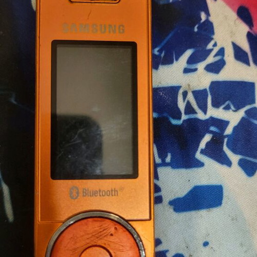 Samsung SGH-X830 used orange phone with charger