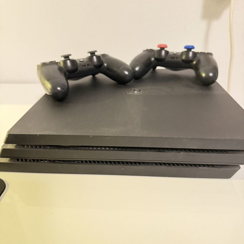 PlayStation 4 1TB like new, 2 consoles with 5 games