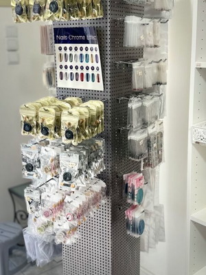 Perforated metal rotating stand like new with 82 hooks
