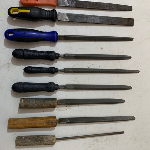 Metal files used, triangular, flat and round