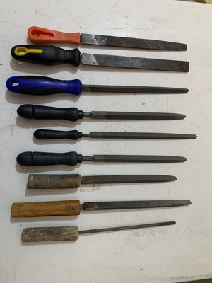 Metal files used, triangular, flat and round