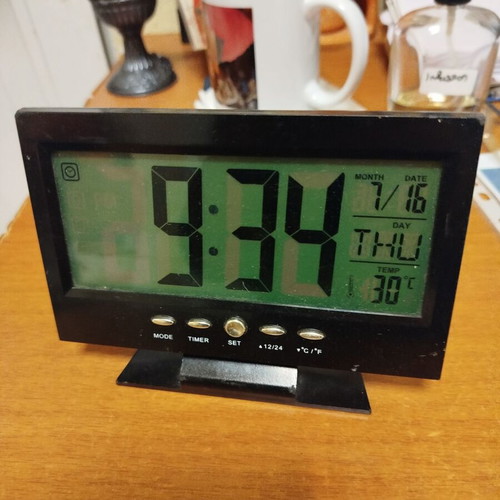 Electronic clock with day, time, temperature display and alarm like new