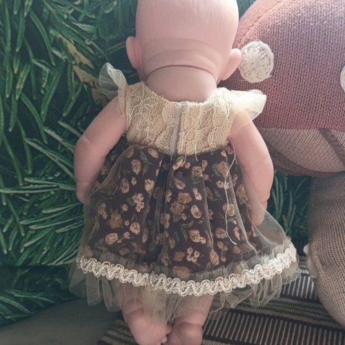 Doll with vintage dress