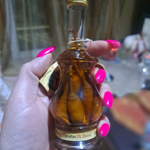 Italian liqueur Cristian di Marko with chili pepper cluster new