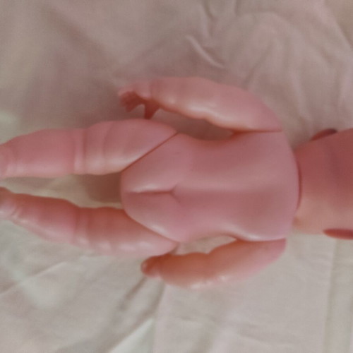 Plastic laughing doll 25cm like new
