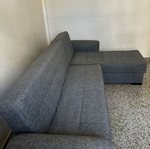 Corner sofa bed with storage compartments