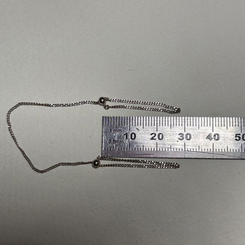 Silver hand chain with rings, modern designer style