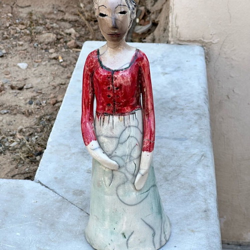 Handmade artistic ceramic woman statue used with rustic style