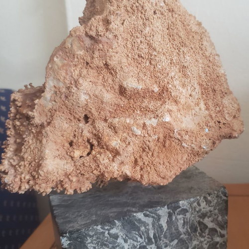 Natural raw mountain crystal used on large marble base