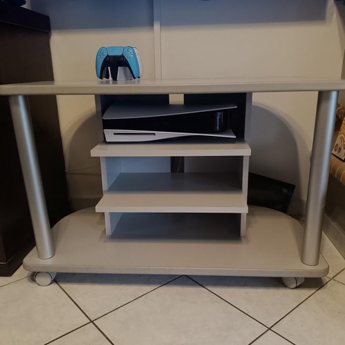 TV stand like new with wheels and 3 shelves