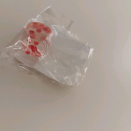 Small decorative dice new, transparent with red details