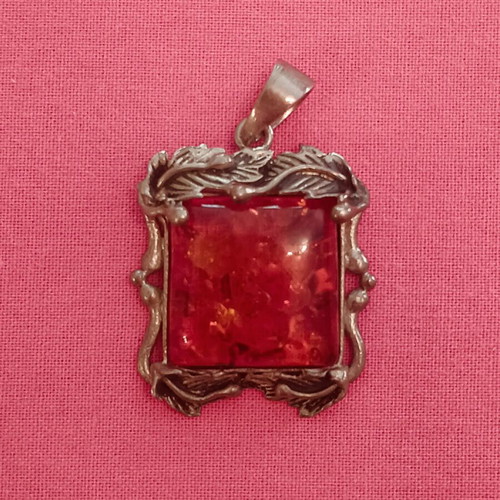 Silver (925) vintage pendant with red/orange amber stone