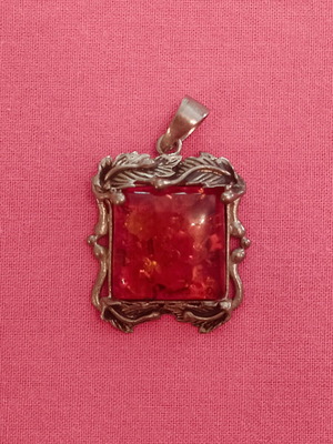 Silver (925) vintage pendant with red/orange amber stone