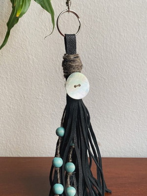 Handmade leather keychain with tassels and coral button, new