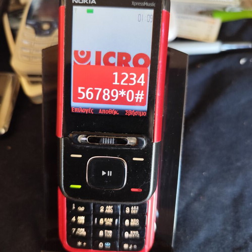 Nokia 5610 XpressMusic phone used with charger