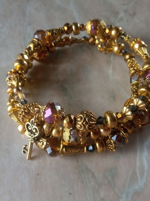 Handmade bracelet new in golden tones