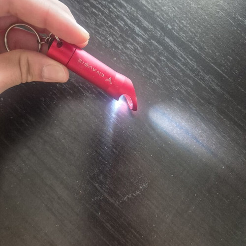 Mini LED flashlight keychain with bottle opener like new, red
