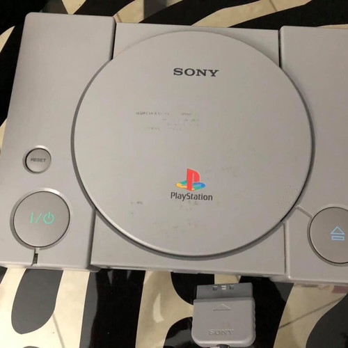 Sony PlayStation console used with official bag, controller and cables