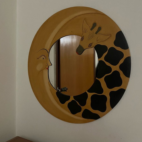 Round mirror with moon and giraffe design