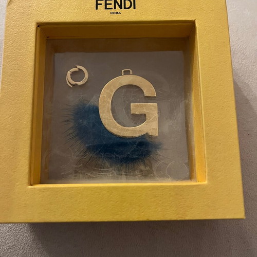 Fendi bag charm letter G with blue fur, like new