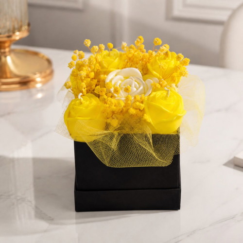 Box with aromatic flowers made of soy wax