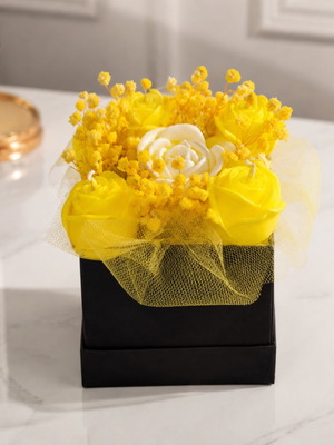 Box with aromatic flowers made of soy wax