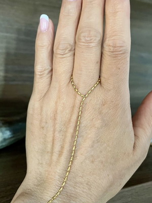 Hand chain in gold tone stainless steel, new