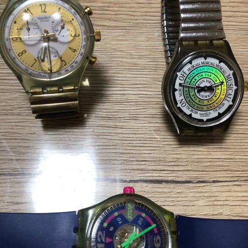 Three used Swatch watches