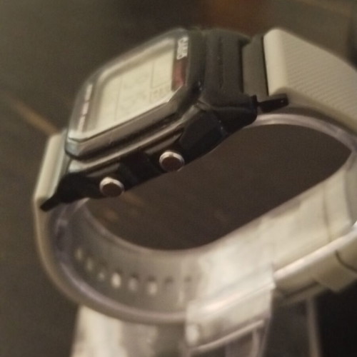 Casio W800H watch with two straps, grey and black