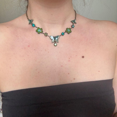 Green necklace used with small butterflies and flowers