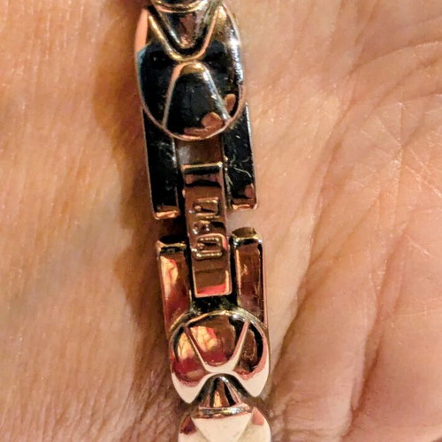Q&Q women's wristwatch like new, bracelet style with gold strass