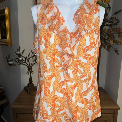 Blouse like new with white and orange chain pattern, size M