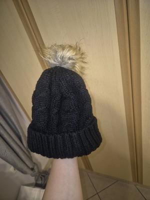 Black knit hat with faux fur used