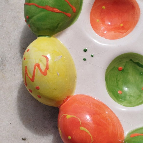 Chicken egg holder with colorful eggs in porcelain new for festive table