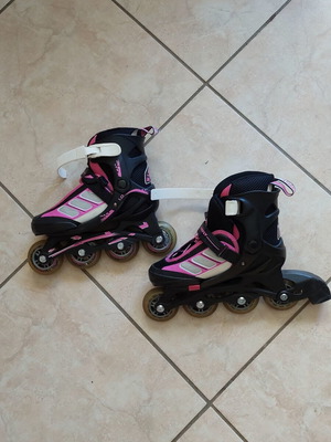 Rollers adjustable size 33-36, like new, black/fuchsia