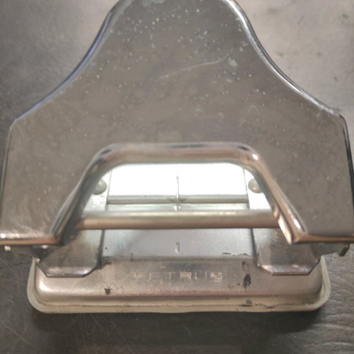 Vintage office accessory used for hole punching pages