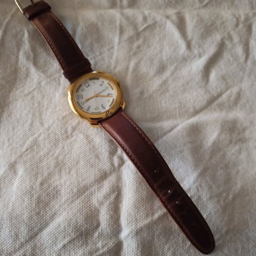 Benetton unisex watch like new, gold color