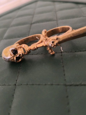 Gold ring with skull and sword like new