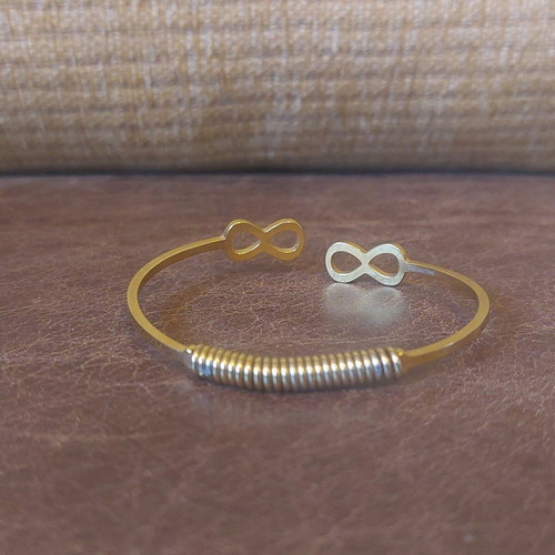Gold infinity handcuff bracelet like new