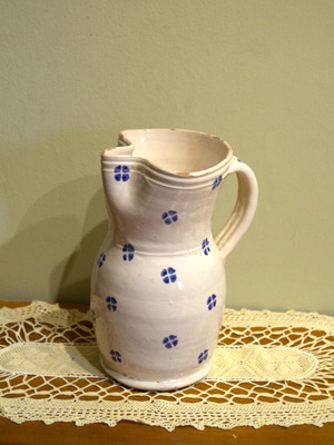 Antique Apulia ceramic pitcher used with blue flower details